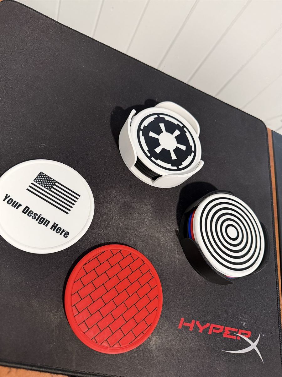 Coasters on a desk mat featuring an Imperial crest and a U.S. flag design